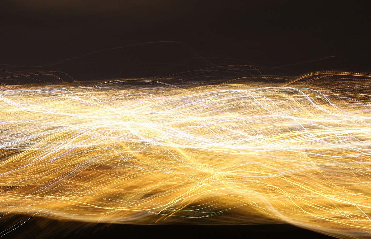 light trail time lapsed photography of yellow light yellow